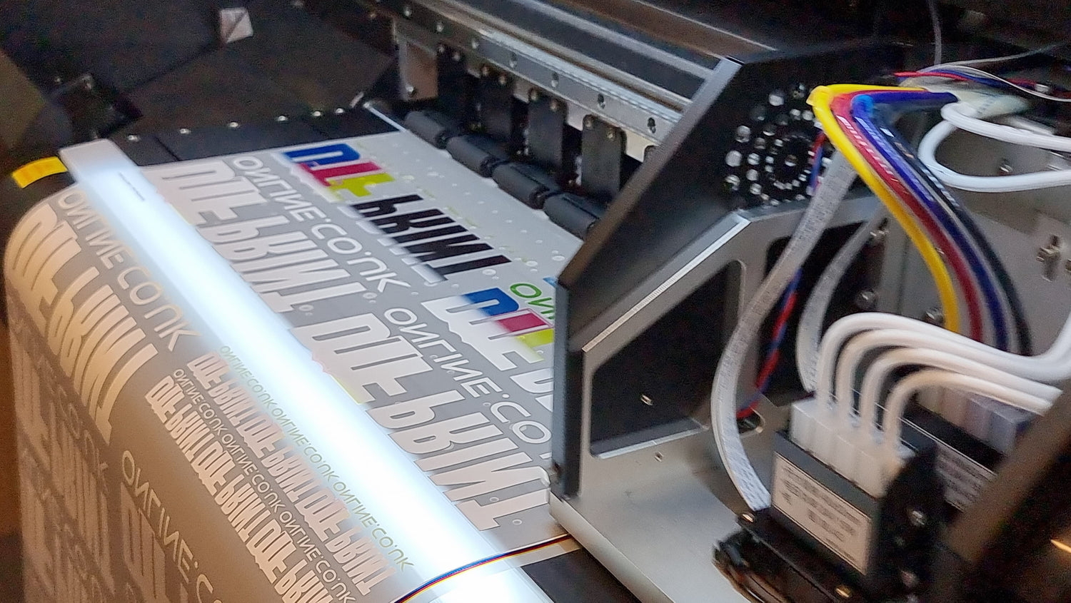 DTF printer close-up showing print head and ink cartridges - DTF Print Online